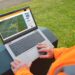 Traffic engineer at roadside looks at laptop screen (image: AGD Systems)