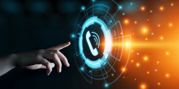 hand with finger pointing to telephone image on futuristic screen (image: Alexandersikov/Dreamstime.com)