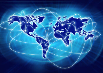 Map of the world in blue, with curved lines running between continents, denoting data transfer (image: Iuliia Kvasha/Dreamstime.com)