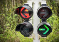 Traffic lights showing green and amber arrows against background of bushes (image: Fottoo/Dreamstime.com)